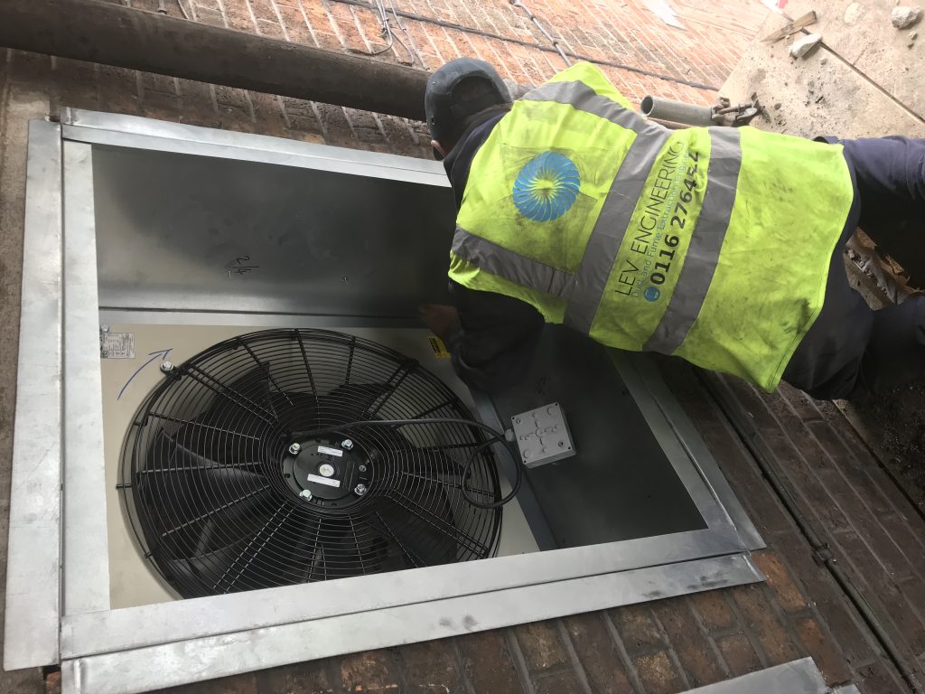 man working on fans